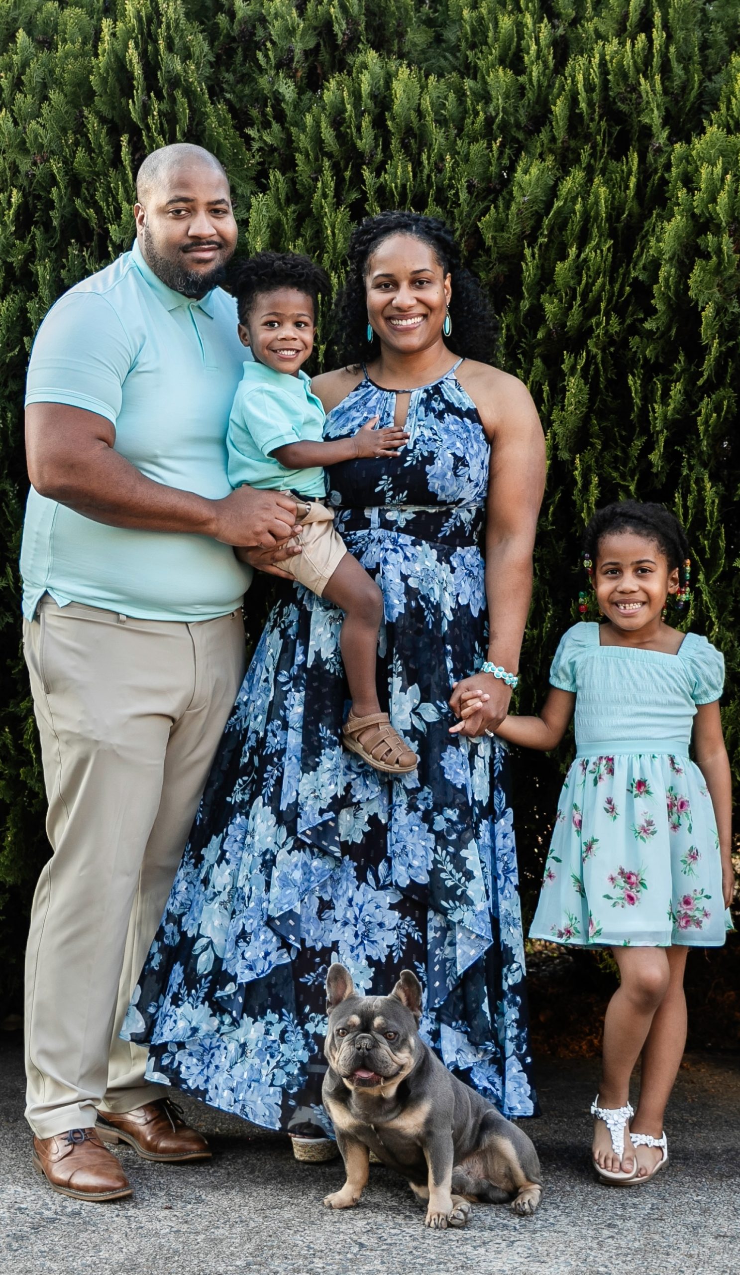 Happy Pet Owners with Golden Retriever – Vets in Goldsboro NC Smiling couple with their kids and dog enjoying a sunny day, representing compassionate care from vets in Goldsboro NC – Vets in Goldsboro NC
